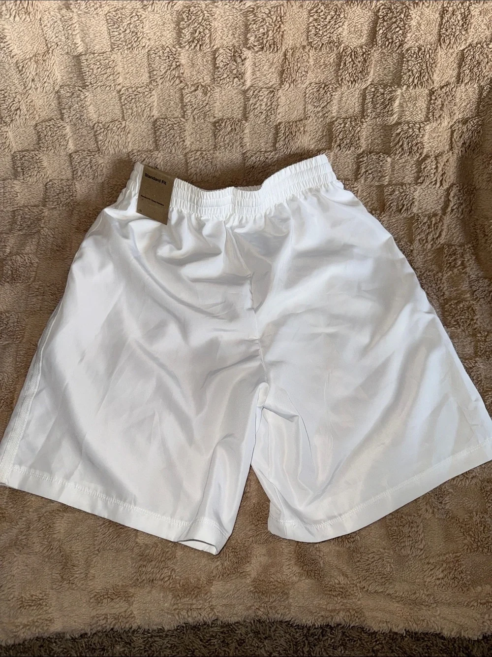 Nike Kids White Athletic Shorts with Black Swoosh Logo
